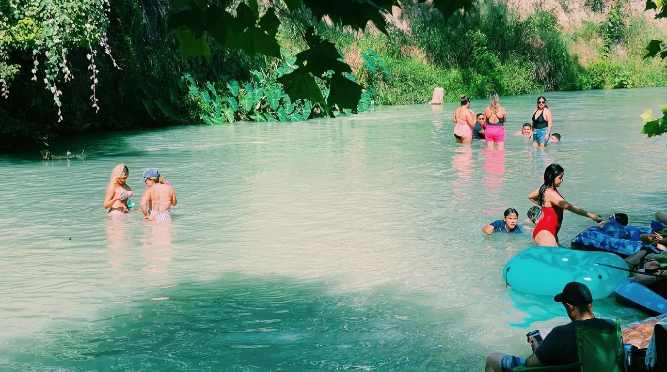 Families enjoying the San Marcos River at Son's Blue River Camp