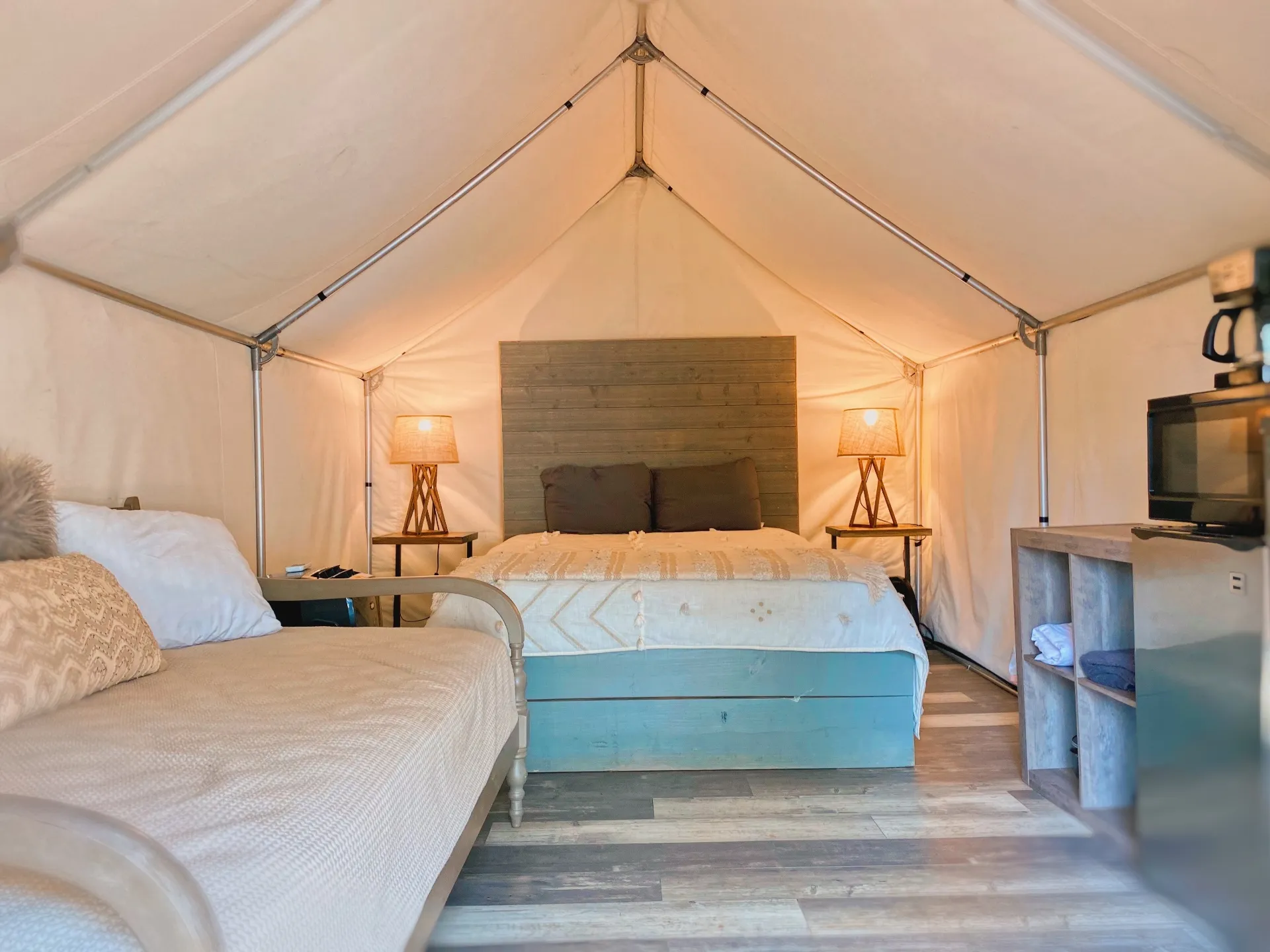 Luxury Glamping Cabin interior with beds