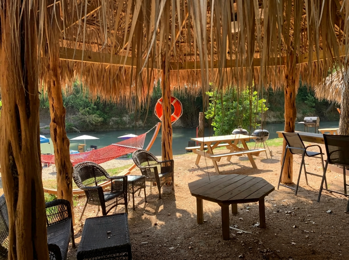 Riverside cabana with hammock and BBQ at Son's Blue River Camp
